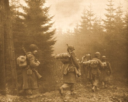 TROOPS OF 325TH GLIDER INFANTRY MOVING THROUGH FOG TO A NEW POSITION